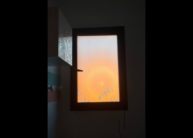 Ventana al atardecer